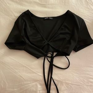 Cross over top with tie.